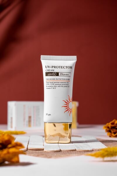 Vertical shot of UV protection cream with SPF 60 in studio lighting.