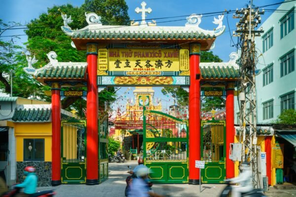 Colorful and historical three-arched gate of Cha Tam Church in Ho Chi Minh City, Vietnam.