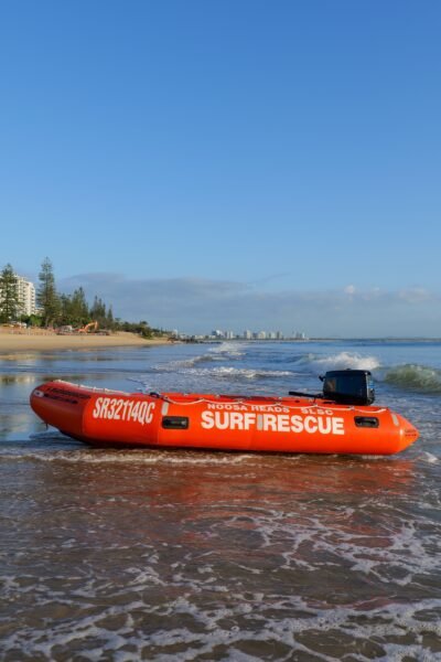 Surf rescue boat at sunrise on Mooloolaba Beach, Queensland, ideal for travel and safety themes.